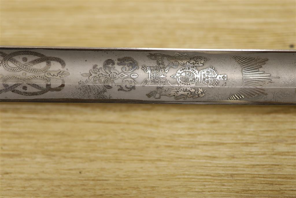 A George V Naval officers sword, by J R Gaunt & Son, Serial No. 16427 together with scabbard and leather case